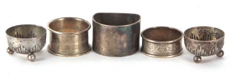 Mixed Lot: A pair of German white metal circular salts, stamped 800, hallmarked silver serviette