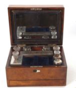 A 19th Century walnut vanity box, ebony banded with insert mother of pearl plaque, the lined