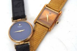 Two Raymond Weil wristwatches, one with a blue dial and the other with a tigers eye style dial, both