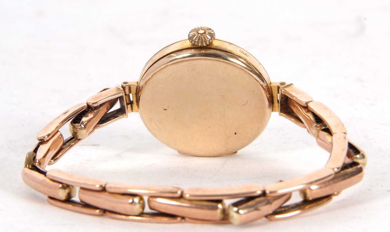 Lady's 9ct gold cased wristwatch on an expanding yellow metal bracelet, the bracelet is stamped - Image 3 of 3