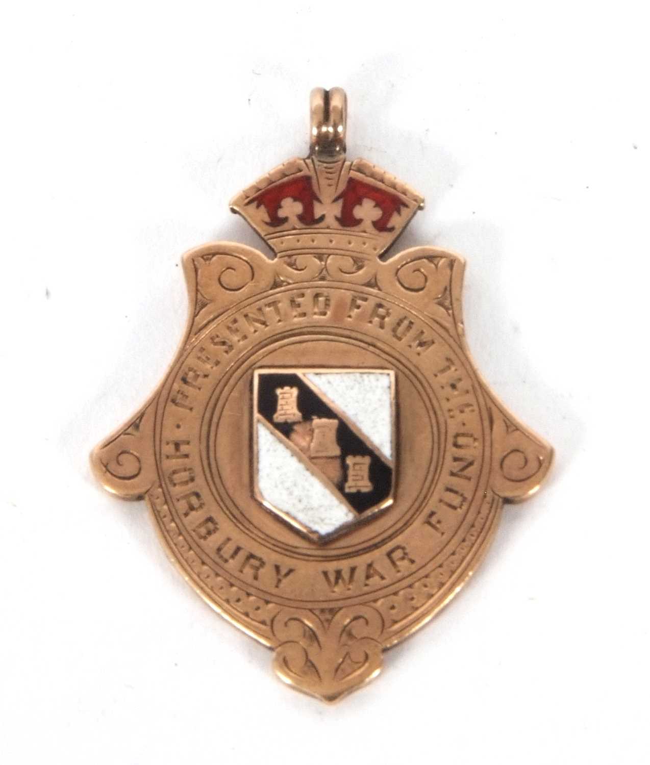 A 9ct gold and enamel shield, hallmarked at the bottom of the shield, it is presentation engraved