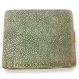 An antique shagreen cigarette case having a full length hinge, push in button mechanism and gilt