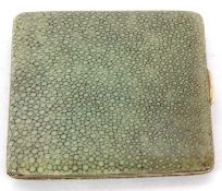 An antique shagreen cigarette case having a full length hinge, push in button mechanism and gilt