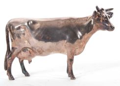 An Elizabeth II silver Guernsey cow model, filled, hallmarked Sheffield 2016, makers mark for