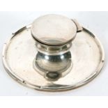 A George V large silver capstan ink well of typical plain form, the loaded base with a stepped