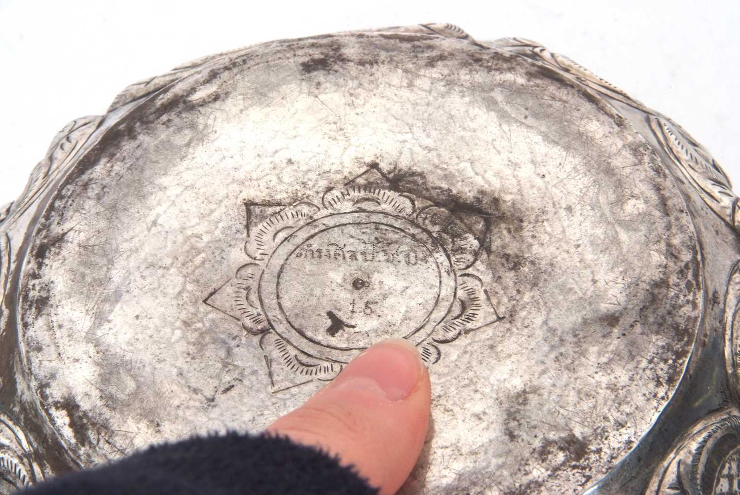 An Indian white metal bowl circa 1915 decorated with images of deities between an arbor of - Image 4 of 5