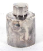 A late Victorian small silver caddy of plain cylindrical form, pull-off lid and hallmarked for