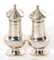 A matched pair of Art Deco casters of geometric design having pull off pierced covers, Birmingham