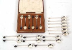 Mixed Lot: Cased set of six George V silver bean end coffee spoons, Birmingham 1922, makers mark for