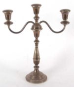 A modern sterling three light candelabra with gadrooned detail to sconces and base (loaded base),