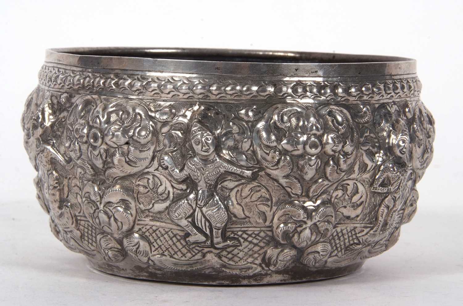 An Indian white metal bowl circa 1915 decorated with images of deities between an arbor of - Image 2 of 5