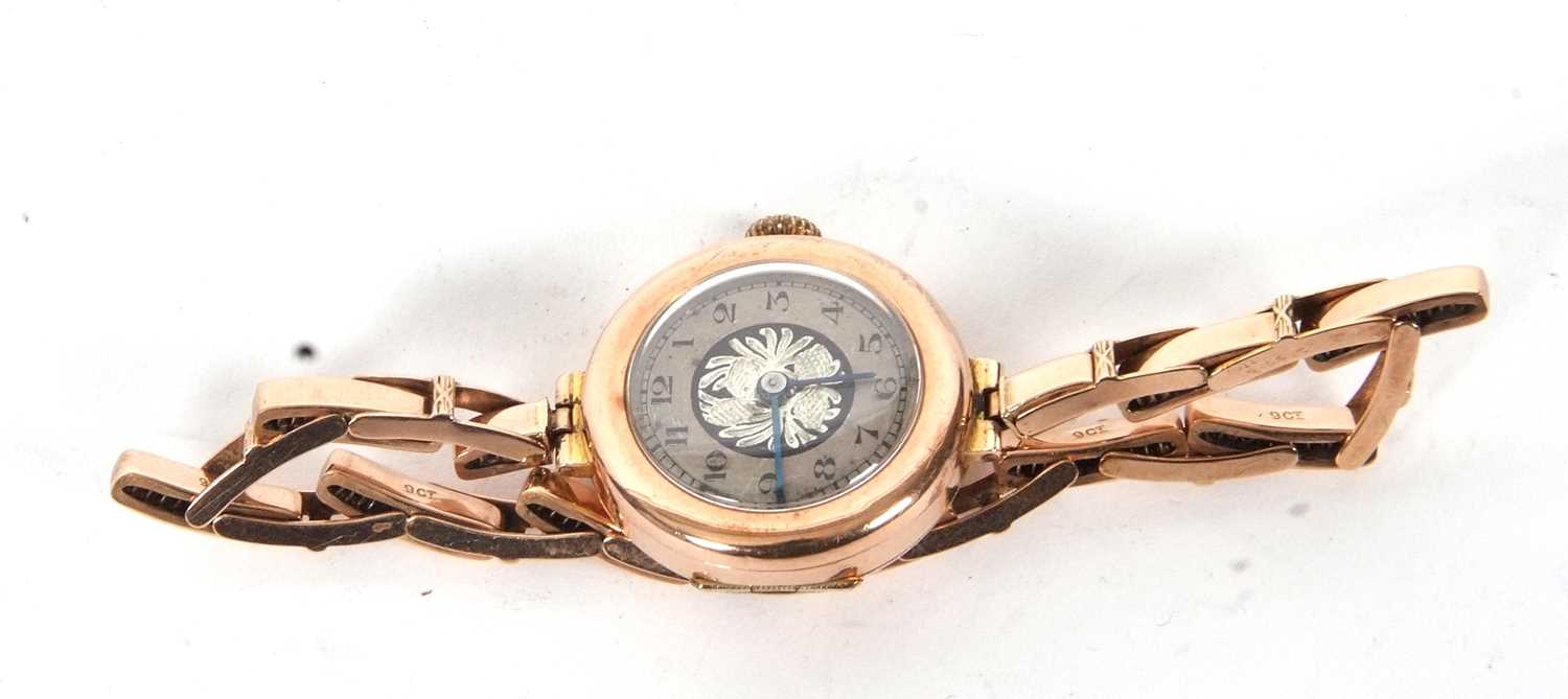 A 9ct gold cased ladies wristwatch on an expanding yellow metal bracelet, the bracelet is stamped - Image 3 of 4