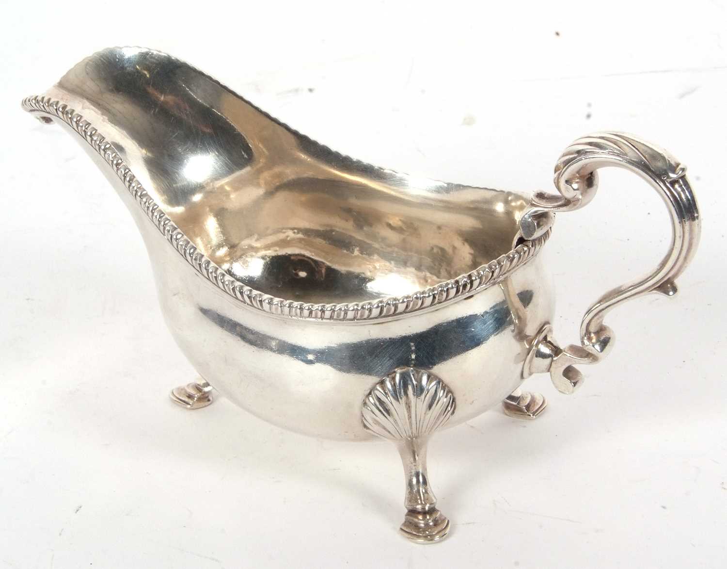 A George III silver large sauce boat of typical form, gadrooned border, leaf-capped scroll handle, - Image 2 of 4