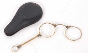 A pair of antique Lorgnette folding glasses, gold plated, in a leather pouch, 12cm long