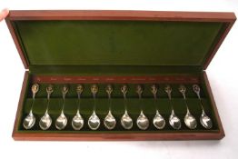 A set of twelve Royal Horticultural Society silver spoons, each set with one of twelve gilt