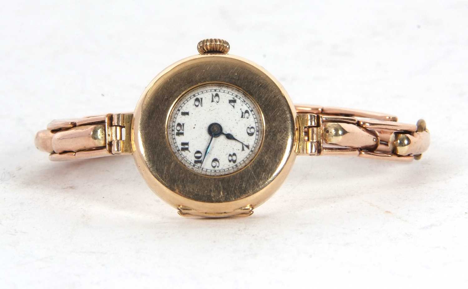 Lady's 9ct gold cased wristwatch on an expanding yellow metal bracelet, the bracelet is stamped - Image 2 of 3