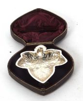 A late Victorian silver leaf shaped dish in the form of a vine leaf, supported on three leaf