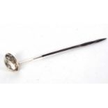 A early 19th Century silver toddy ladle having a twisted baleen handle, oval shaped bowl with a