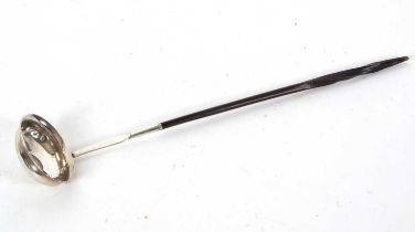 A early 19th Century silver toddy ladle having a twisted baleen handle, oval shaped bowl with a