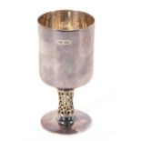 An Elizabeth II silver goblet having a plain bowl on a pierced silver gilt stem to a circular