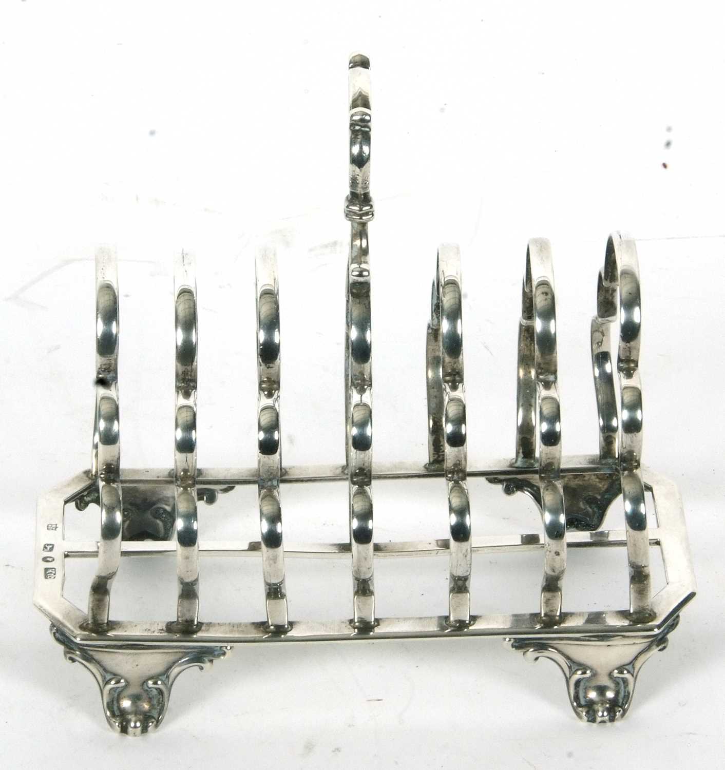 A large Victorian silver toast rack having six shaped divisions, central loop carrying handle, - Image 2 of 3