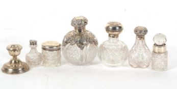 Mixed Lot: An Edwardian cut glass globular scent bottle having a plain silver collar and cherub