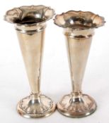 Pair of hallmarked silver vases of trumpet shape with crimped rims and plain tapering stems,