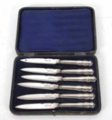 Cased set of six George V silver handled tea knives with EPNS blades, the handles hallmarked for