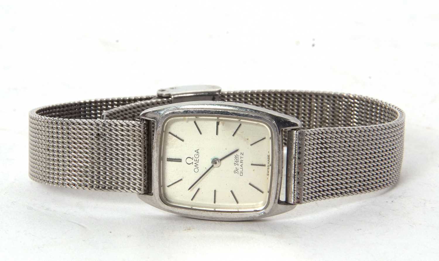 A stainless steel Omega De Ville quartz wristwatch, it has a silver coloured dial with black baton