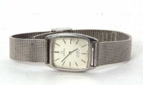 A stainless steel Omega De Ville quartz wristwatch, it has a silver coloured dial with black baton