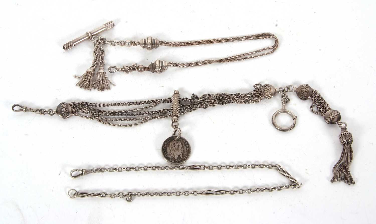 Three pocket watch chains, one of which tests for white metal on the slider and central chain, the T