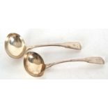 Pair of George III silver fiddle pattern ladles, initialled, having oval shaped bowls and hallmarked