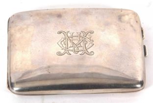 A George V silver cigarette case of slight curved rectangular form, plain polished and engraved