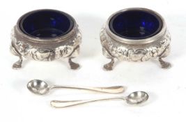 A pair of Victorian silver cauldron salts and liners, each raised upon three hoof feet with