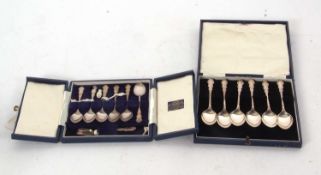Cased set of decorative silver teaspoons together with a cased set of matching egg spoons and salt