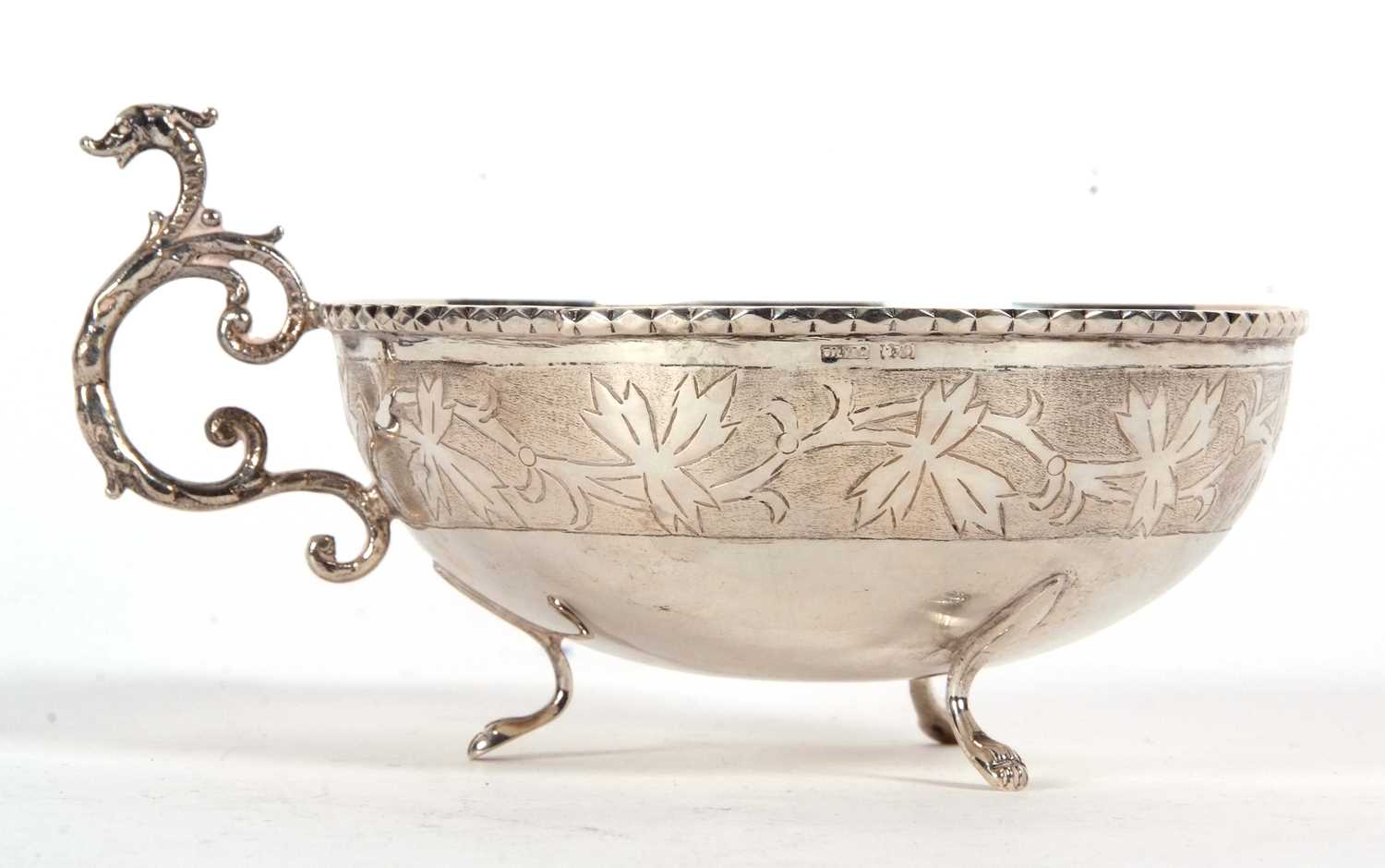 A Scandinavian white metal circular bowl having an applied cast rope twist design rim, engraved