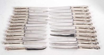 Twelve silver handled Kings pattern table knives, twelve silver handled dessert knives together with