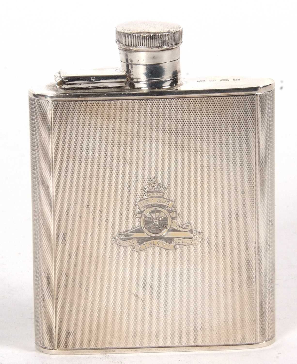 A George VI silver spirit flask, engine turned decorated, the front engraved with The Royal