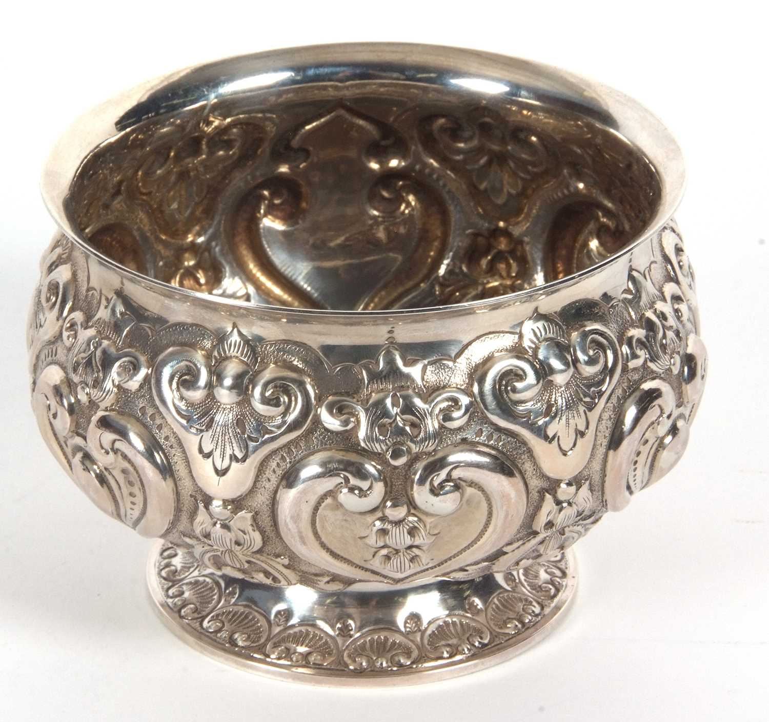 A late Victorian silver pedestal bowl of squat circular form, elaborately embossed all over with - Image 3 of 4