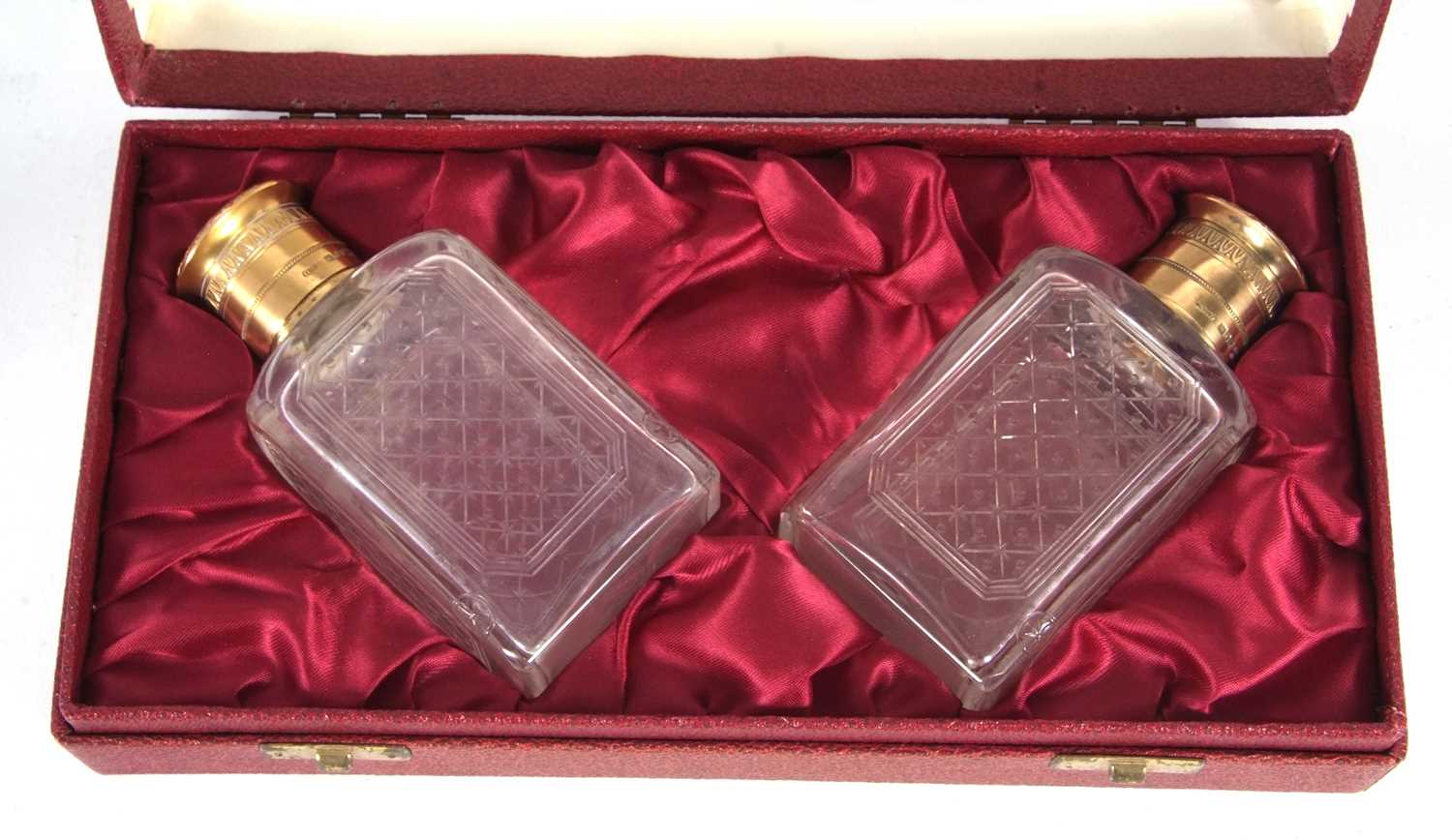 A cased pair of Asprey & Co cologne bottles, the glass etched bodies with gilt metal collars and - Image 2 of 3