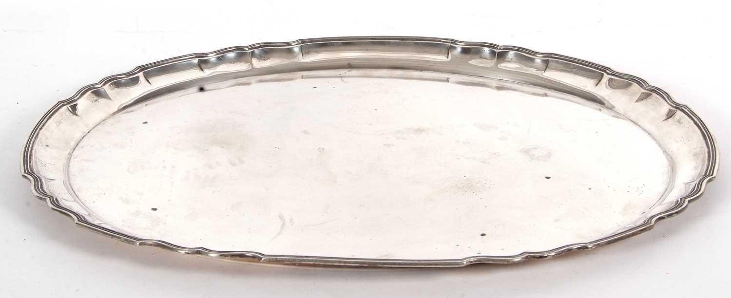 A large German 800 marked oval tray of plain form with applied reeded scallop border, 53 x 48cm, 2.