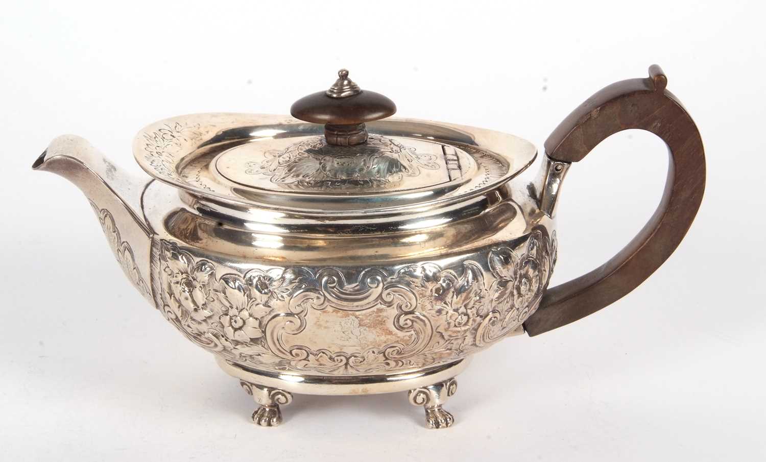 A George III silver teapot of oval form and elaborately decorated with scrolled flowers, - Image 2 of 4