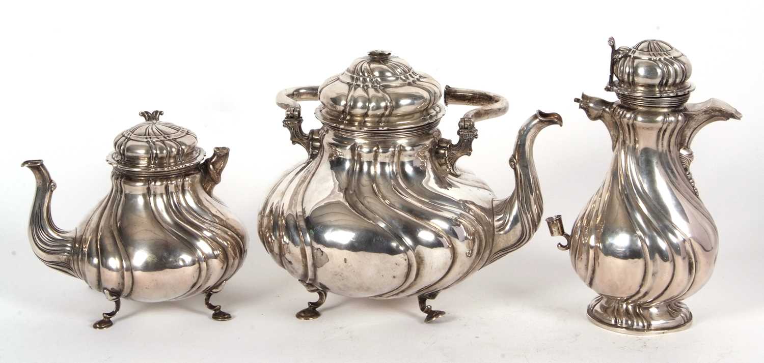 A 19th Century German white metal tea set comprising a large coffee pot, teapot, hot water kettle,