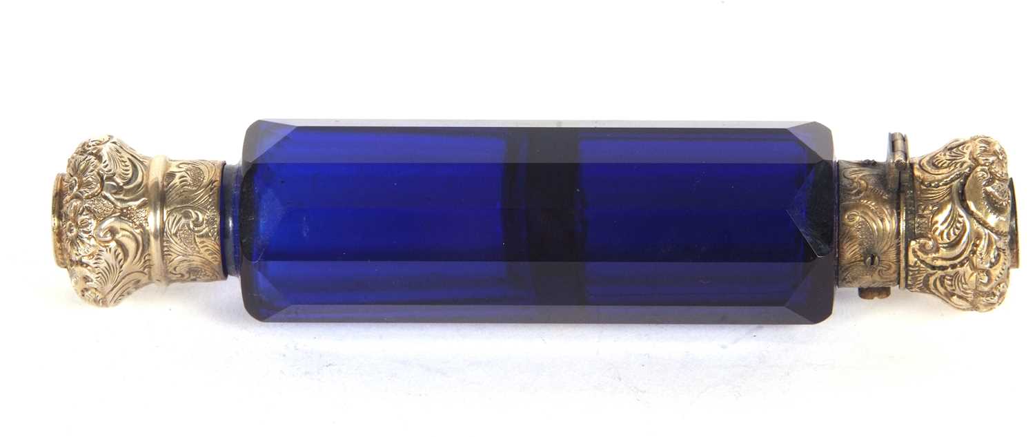 An antique Victorian cobalt blue glass scent bottle with fasceted glass body with screw on and