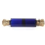 An antique Victorian cobalt blue glass scent bottle with fasceted glass body with screw on and