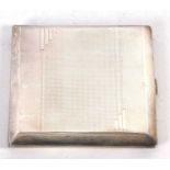 An Art Deco silver cigarette case of rectangular form, engine turned decoration, front and back