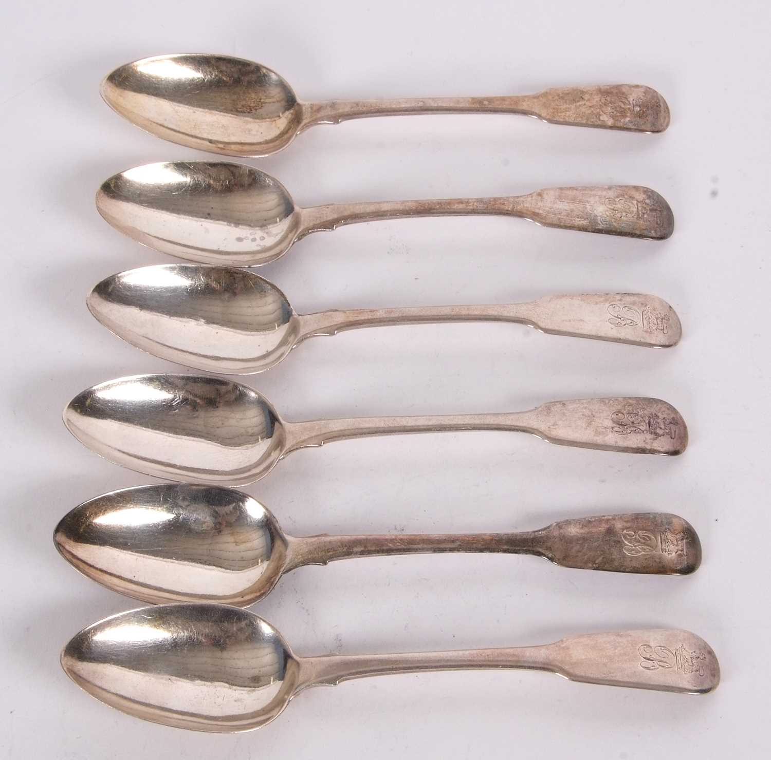 A set of six George IV silver dessert spoons, fiddle pattern, engraved with initials and armorial,