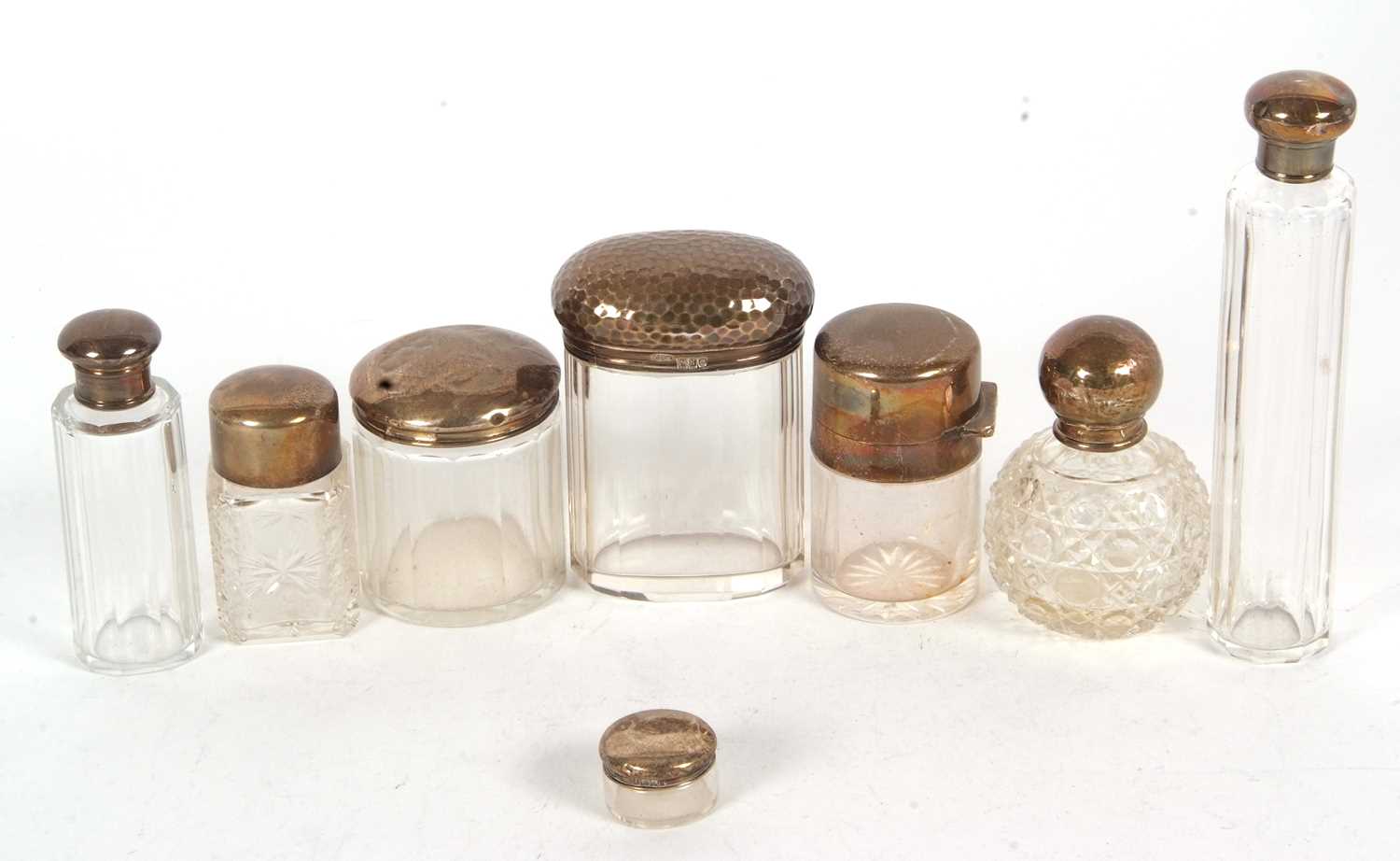 Group of eight glass dressing table jars with hallmarked silver lids, various dates and makers - Image 2 of 2