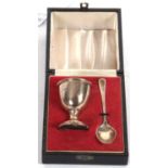 A cased Christening egg cup and spoon, Sheffield 1971, makers mark for A T Canon Ltd