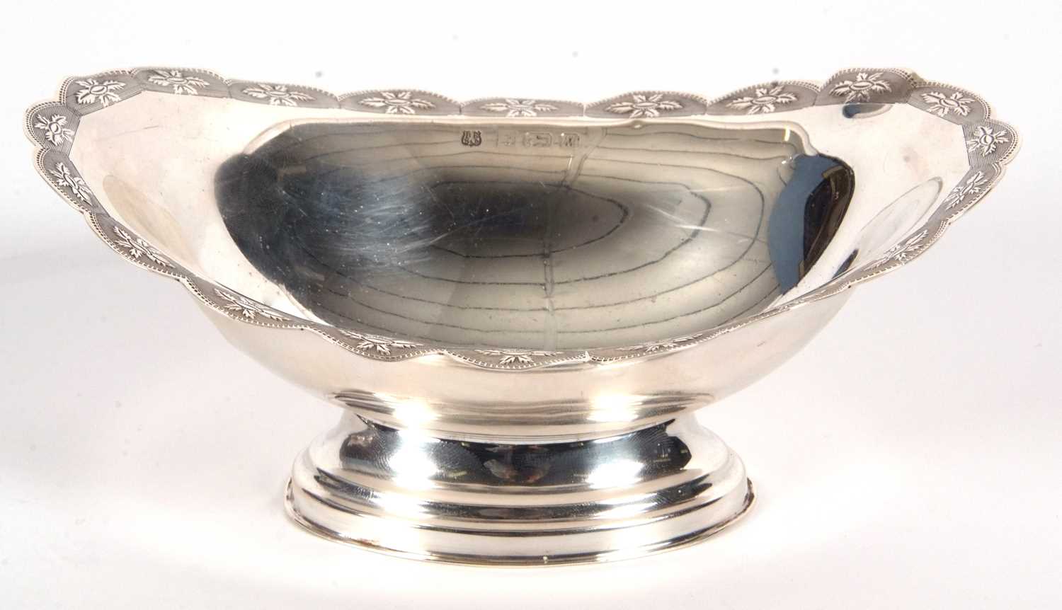 An Elizabeth II silver small pedestal dish of oval form having a shaped border, chased and - Image 3 of 4